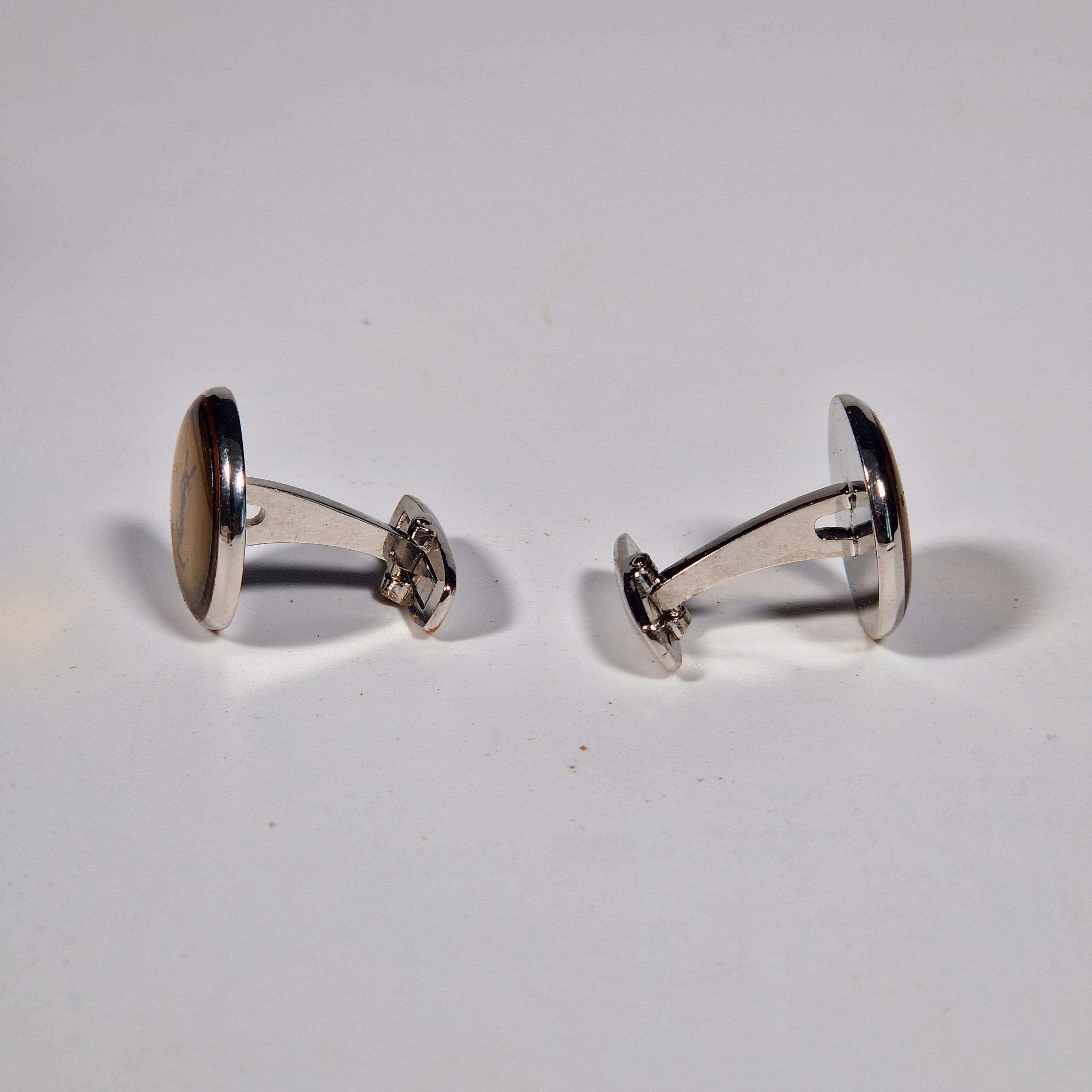 Yves Saint Laurent a pair of cufflinks and a tie pin with box.