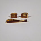 Yves Saint Laurent a pair of cufflinks and a tie pin with box.