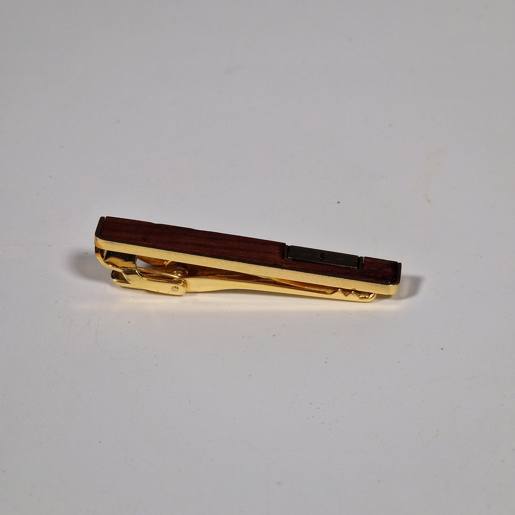 Yves Saint Laurent a pair of cufflinks and a tie pin with box.