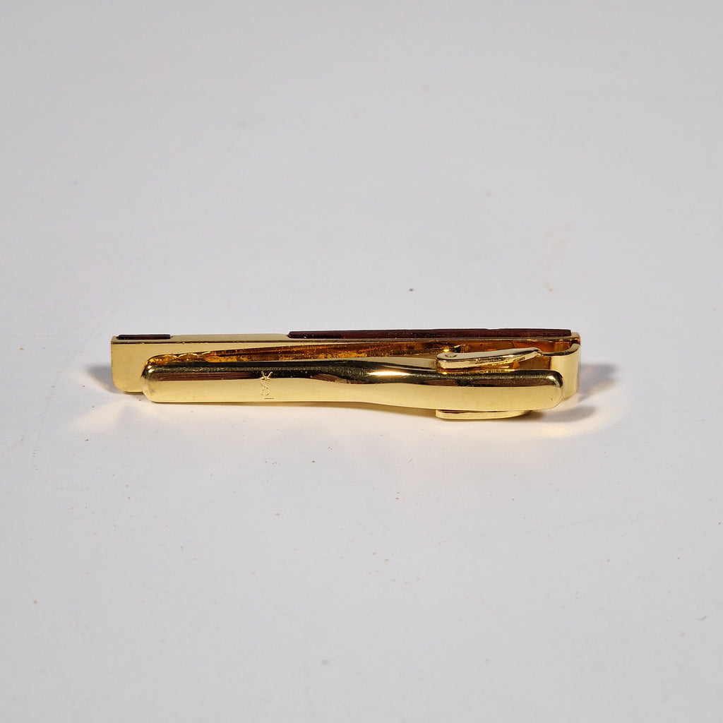 Yves Saint Laurent a pair of cufflinks and a tie pin with box.
