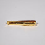 Yves Saint Laurent a pair of cufflinks and a tie pin with box.