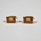 Yves Saint Laurent a pair of cufflinks and a tie pin with box.