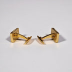 Yves Saint Laurent a pair of cufflinks and a tie pin with box.