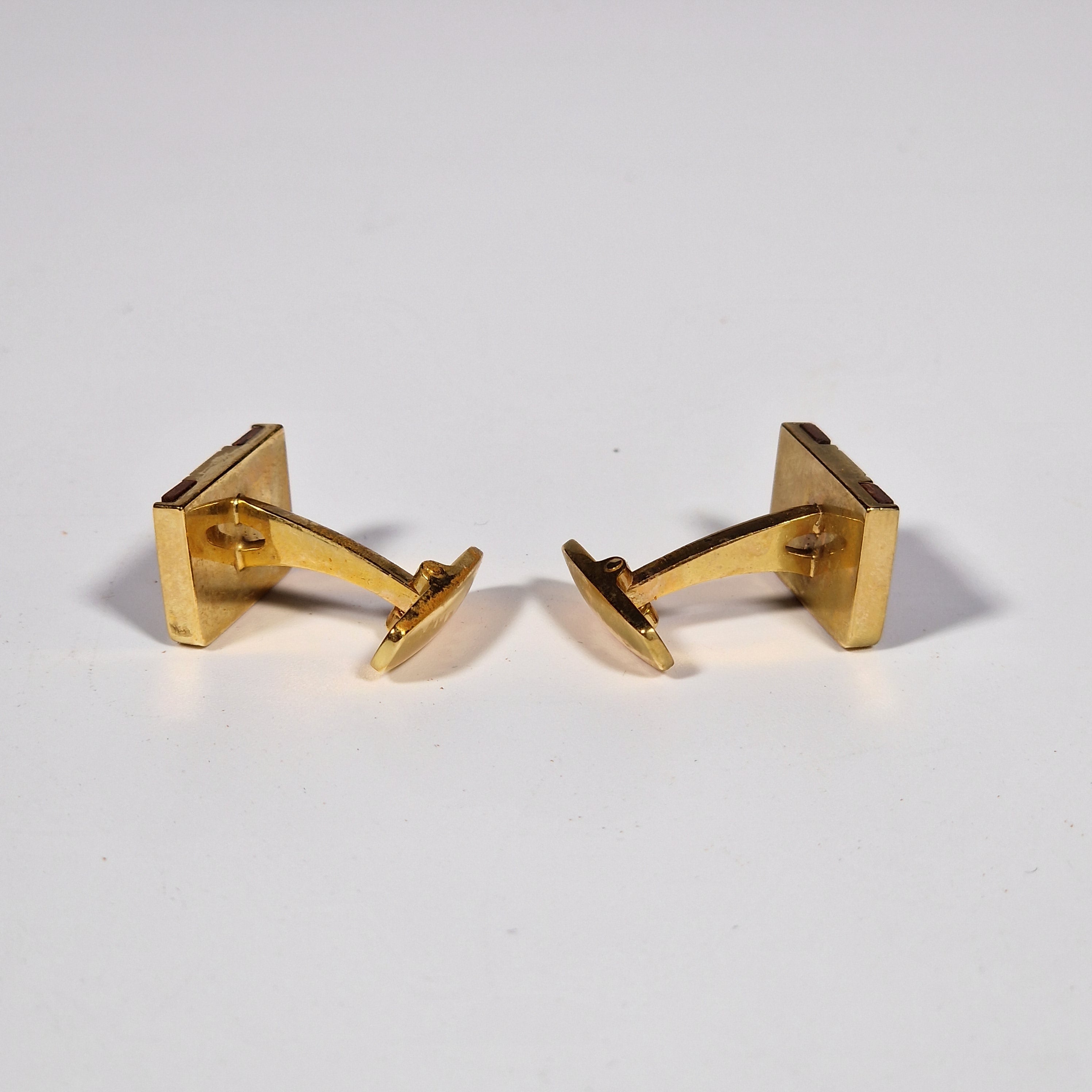 Yves Saint Laurent a pair of cufflinks and a tie pin with box.