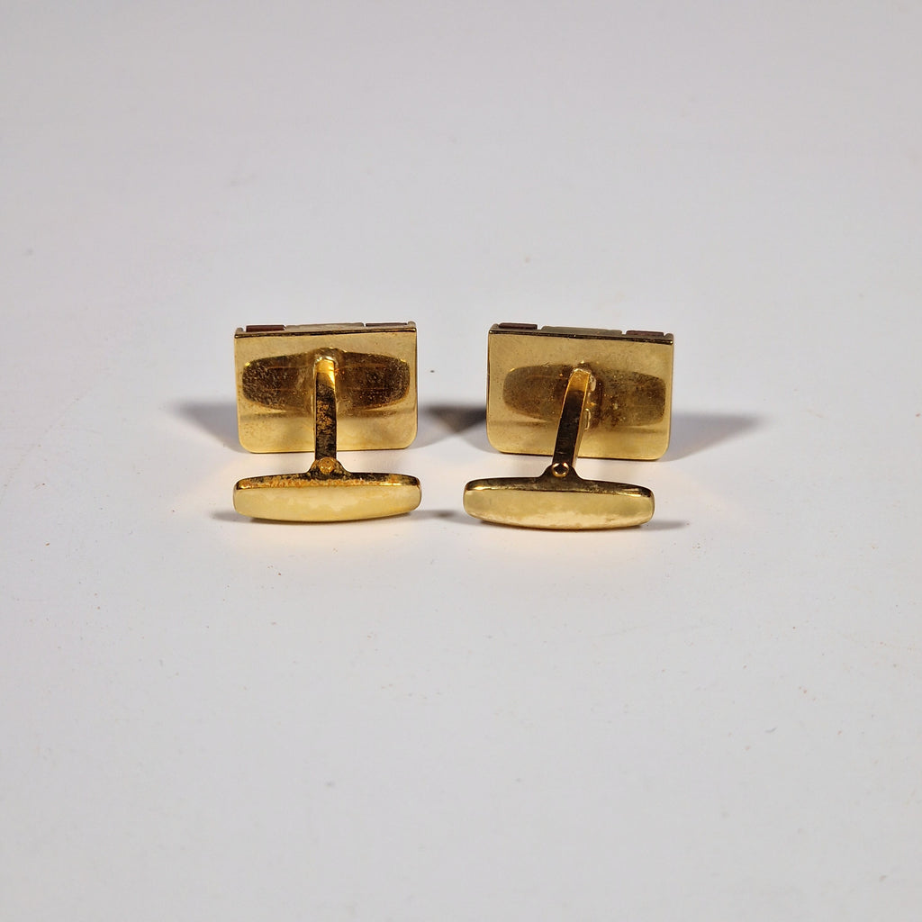 Yves Saint Laurent a pair of cufflinks and a tie pin with box.