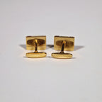 Yves Saint Laurent a pair of cufflinks and a tie pin with box.