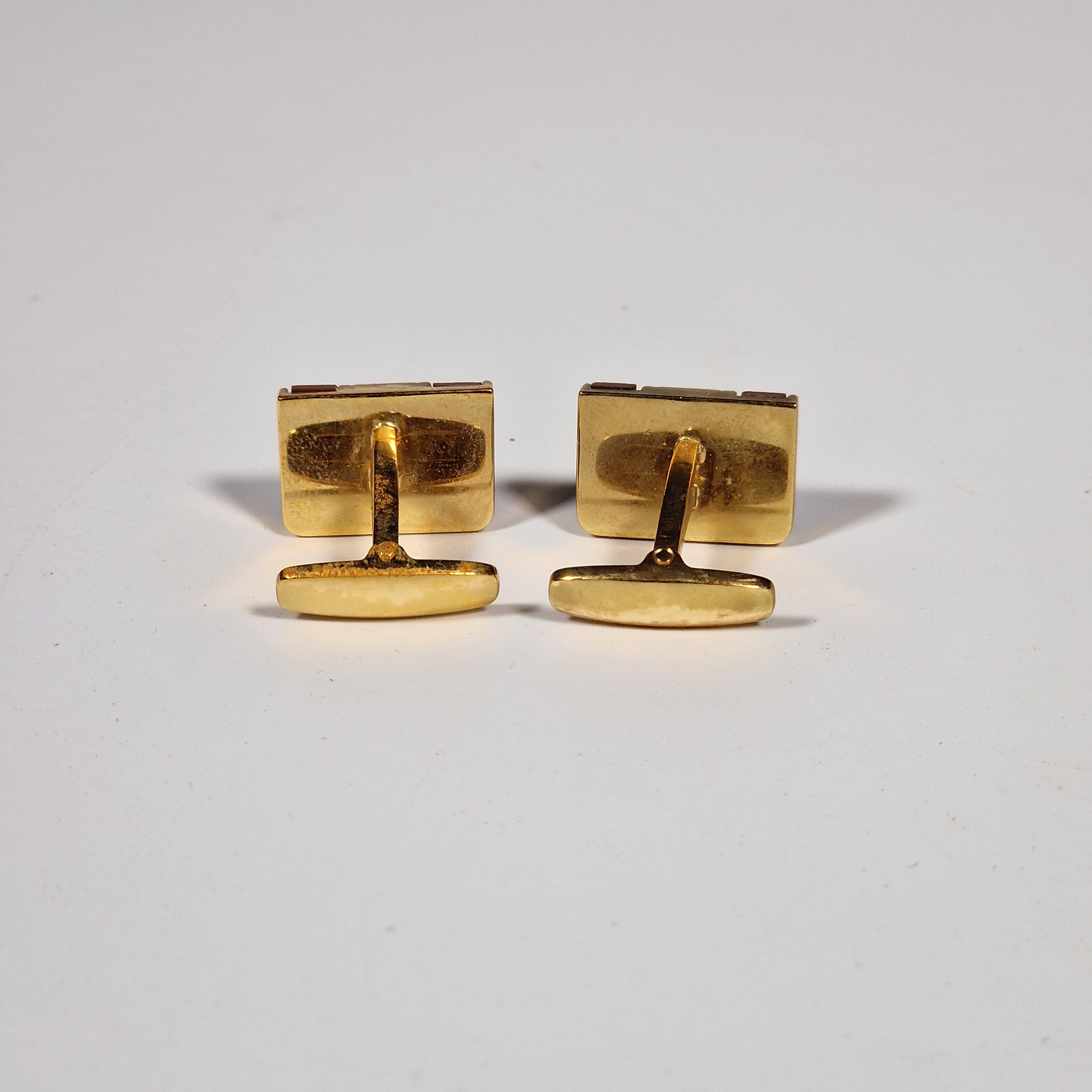 Yves Saint Laurent a pair of cufflinks and a tie pin with box.