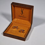 Yves Saint Laurent a pair of cufflinks with box.