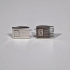 Yves Saint Laurent a pair of cufflinks and a tie pin with box.