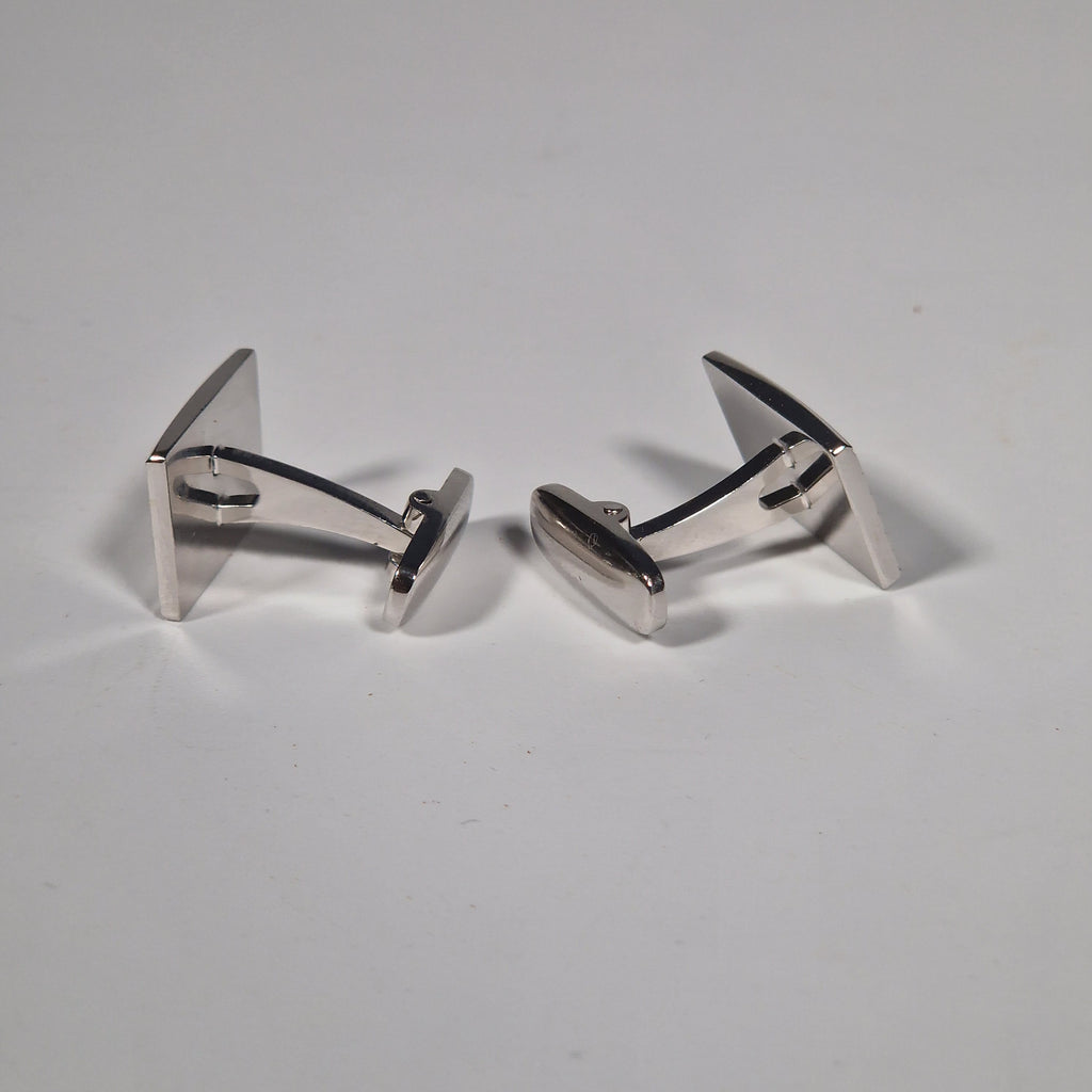 Yves Saint Laurent a pair of cufflinks and a tie pin with box.