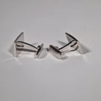 Yves Saint Laurent a pair of cufflinks and a tie pin with box.