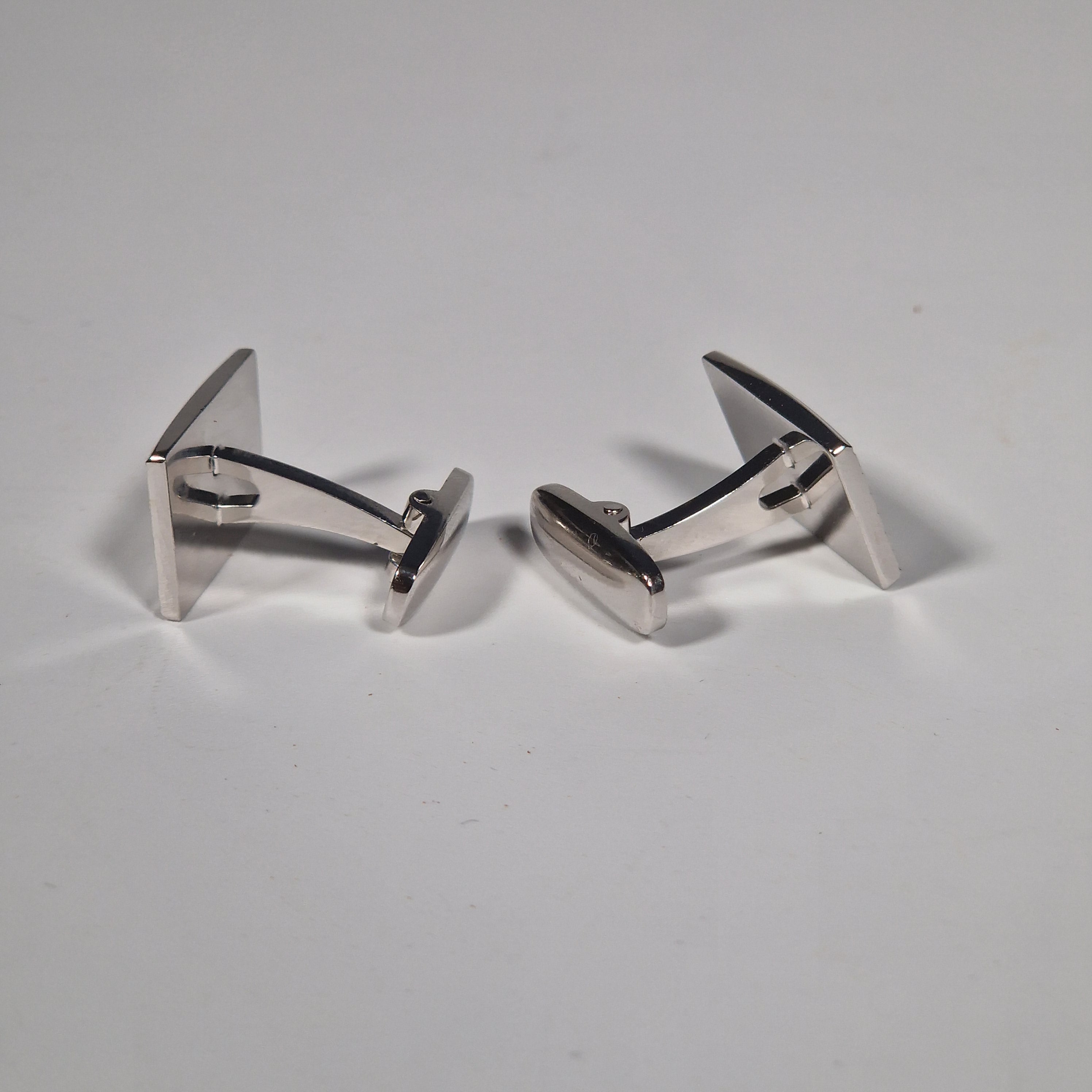 Yves Saint Laurent a pair of cufflinks and a tie pin with box.