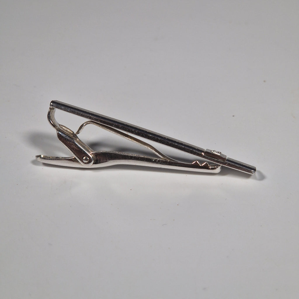 Yves Saint Laurent a pair of cufflinks and a tie pin with box.