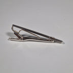 Yves Saint Laurent a pair of cufflinks and a tie pin with box.