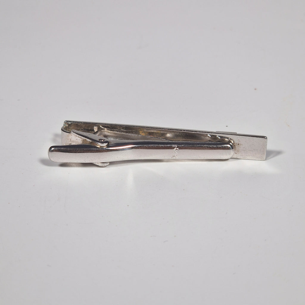 Yves Saint Laurent a pair of cufflinks and a tie pin with box.