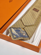 339301 Hermès tie yellow T-rex and H pattern 339301 T