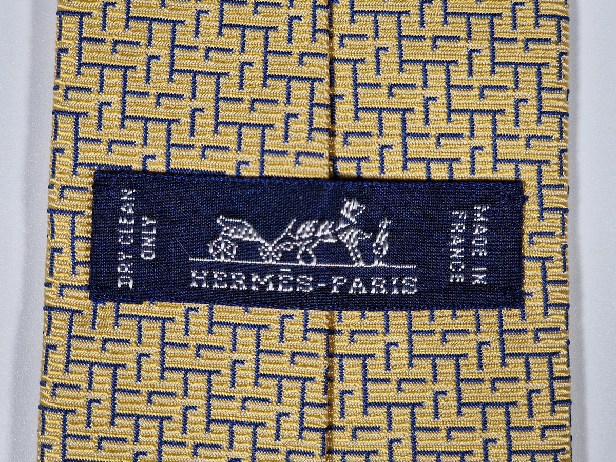 339301 Hermès tie yellow T-rex and H pattern 339301 T