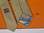 339301 Hermès tie yellow T-rex and H pattern 339301 T