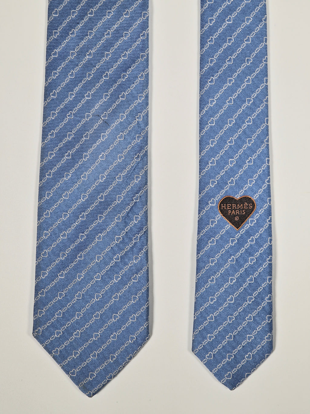 Hermès silk tie blue chain and hearts pattern 339360 T