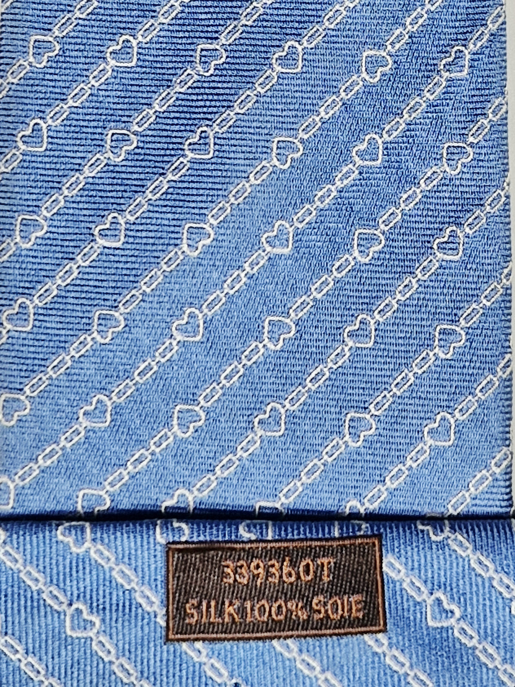 Hermès silk tie blue chain and hearts pattern 339360 T