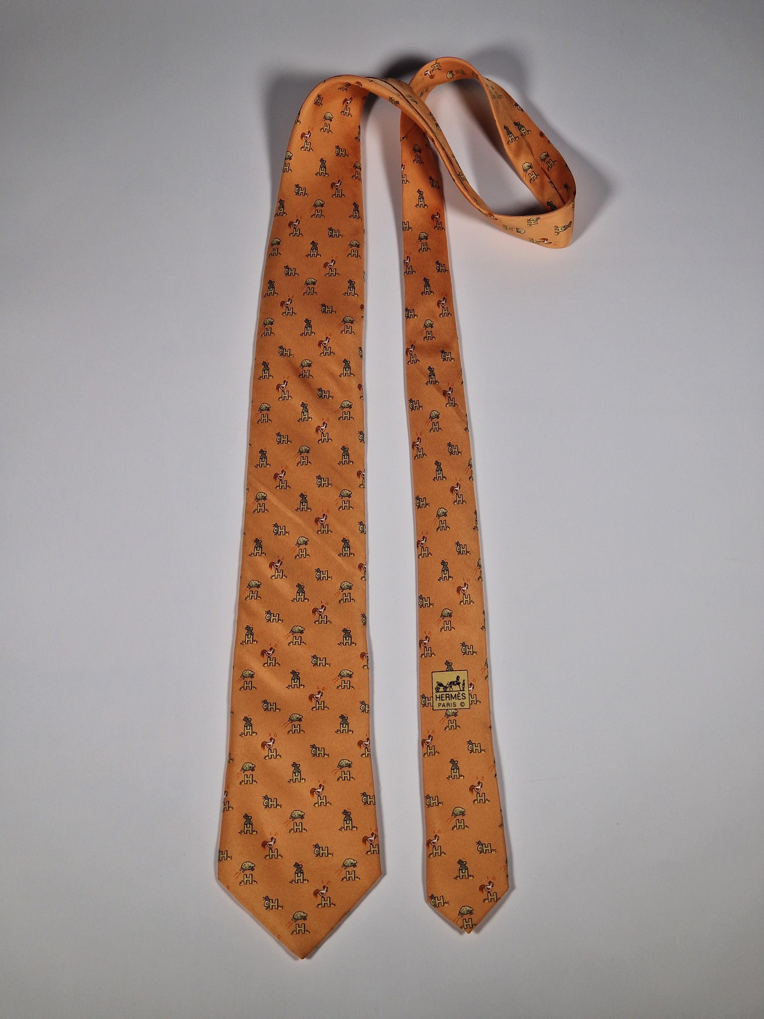 Hermès silk tie orange Animals and H pattern whimsical 5029 FA