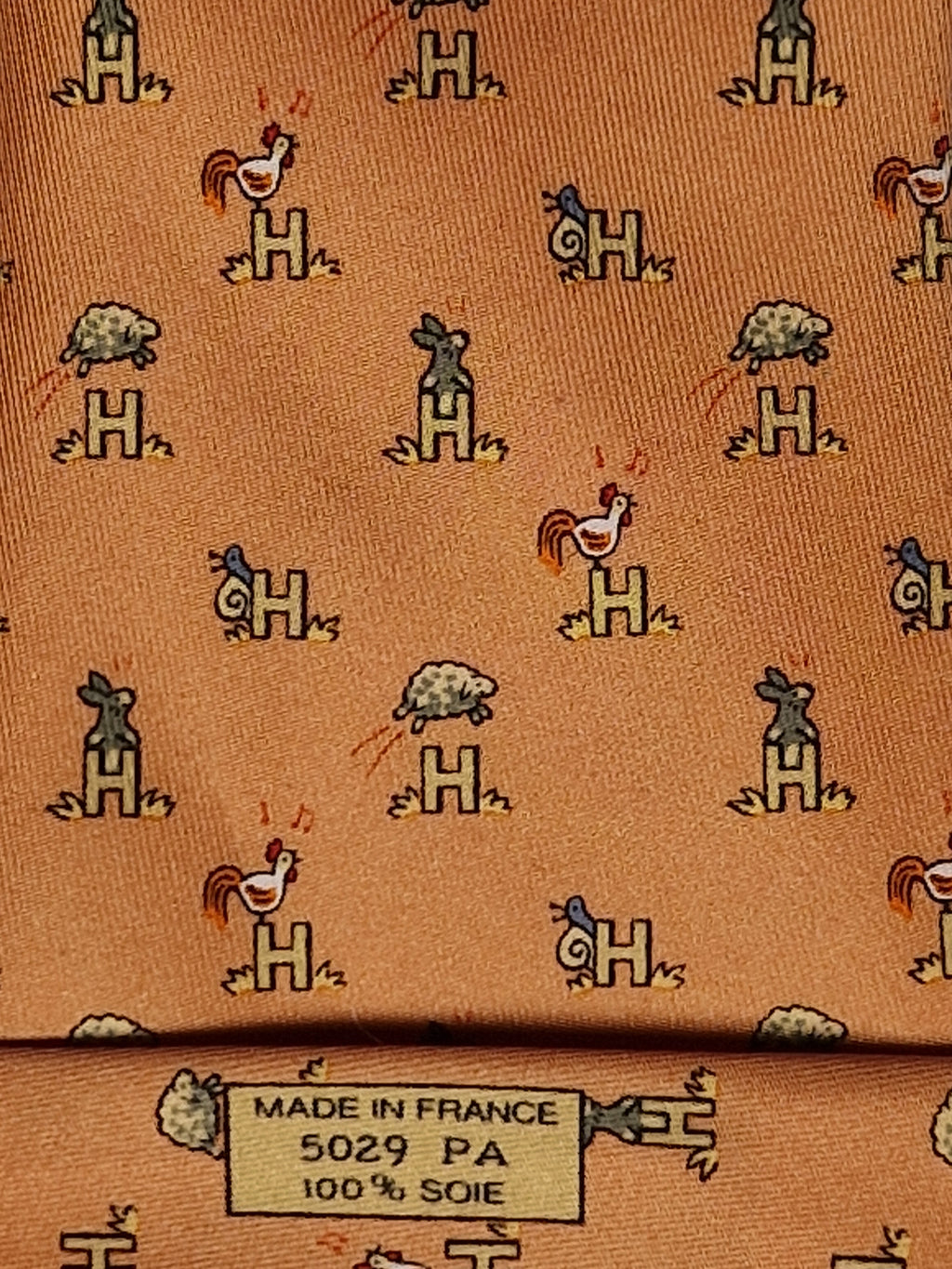Hermès silk tie orange Animals and H pattern whimsical 5029 FA