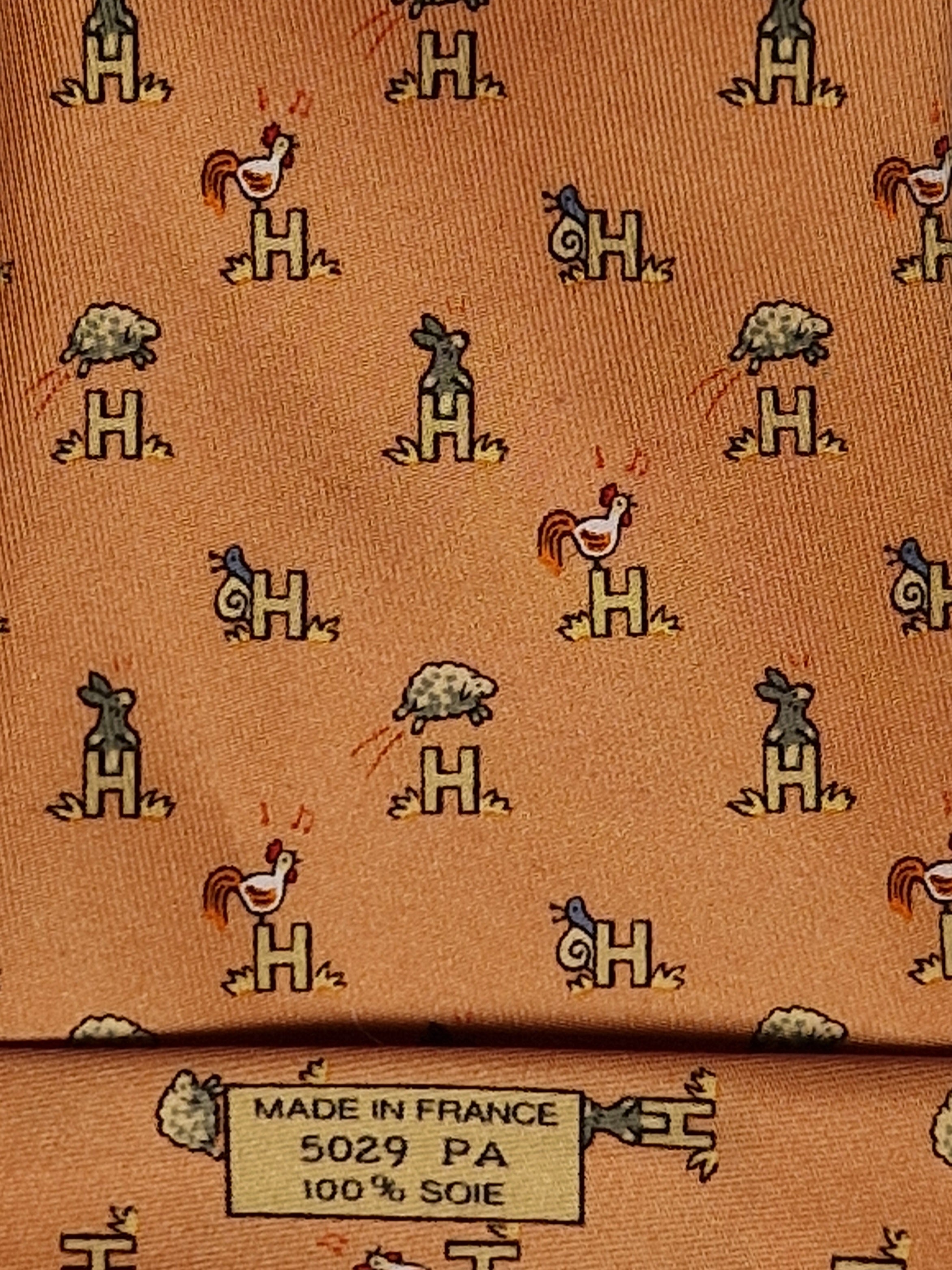 Hermès silk tie orange Animals and H pattern whimsical 5029 FA