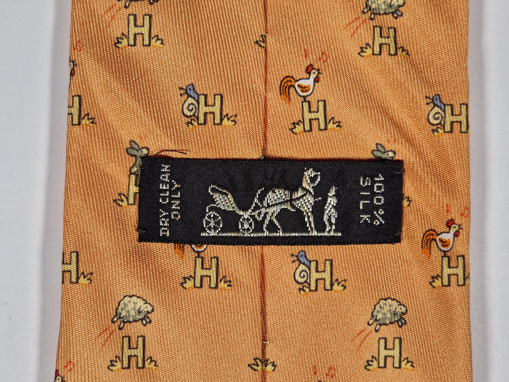 Hermès silk tie orange Animals and H pattern whimsical 5029 FA