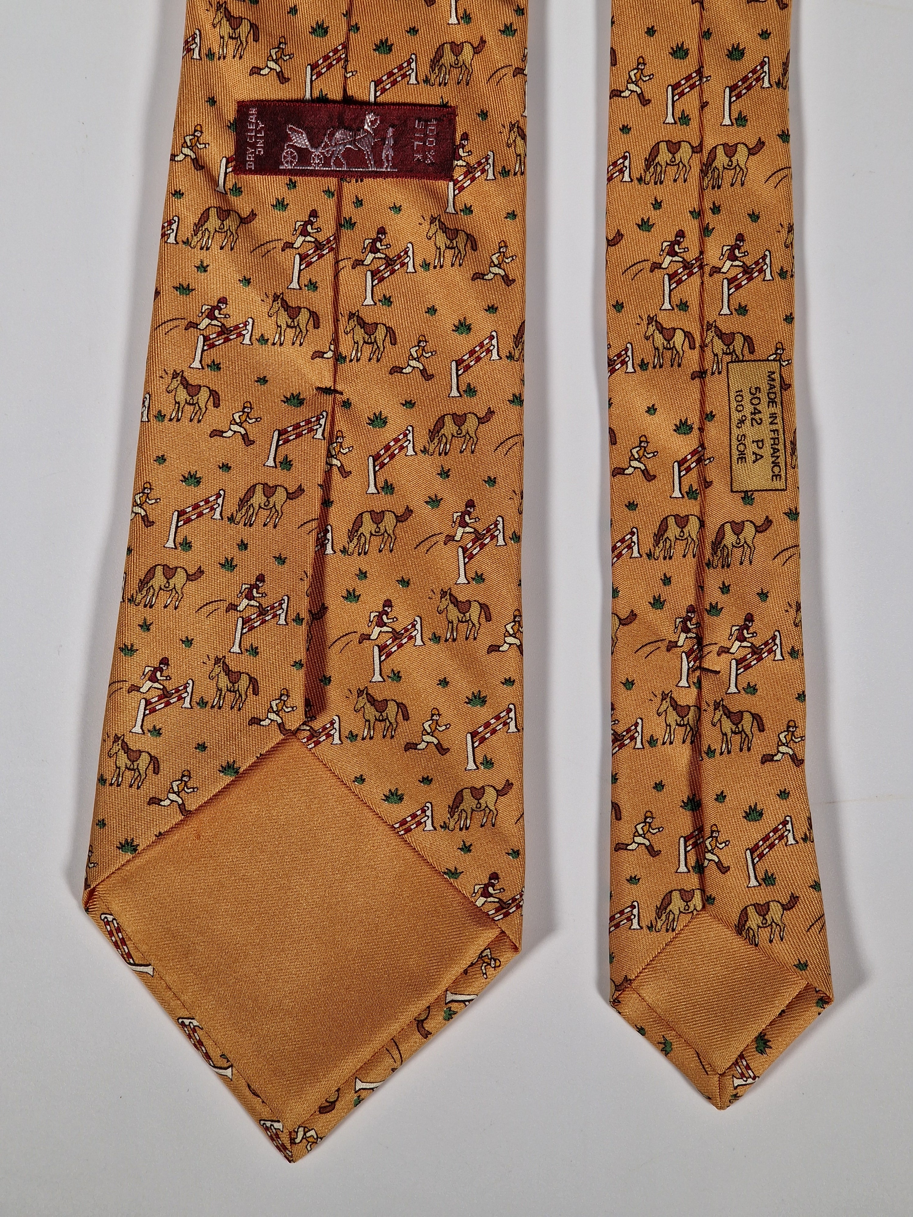 Hermès silk tie orange whimsical equestrian pattern 5042 PA