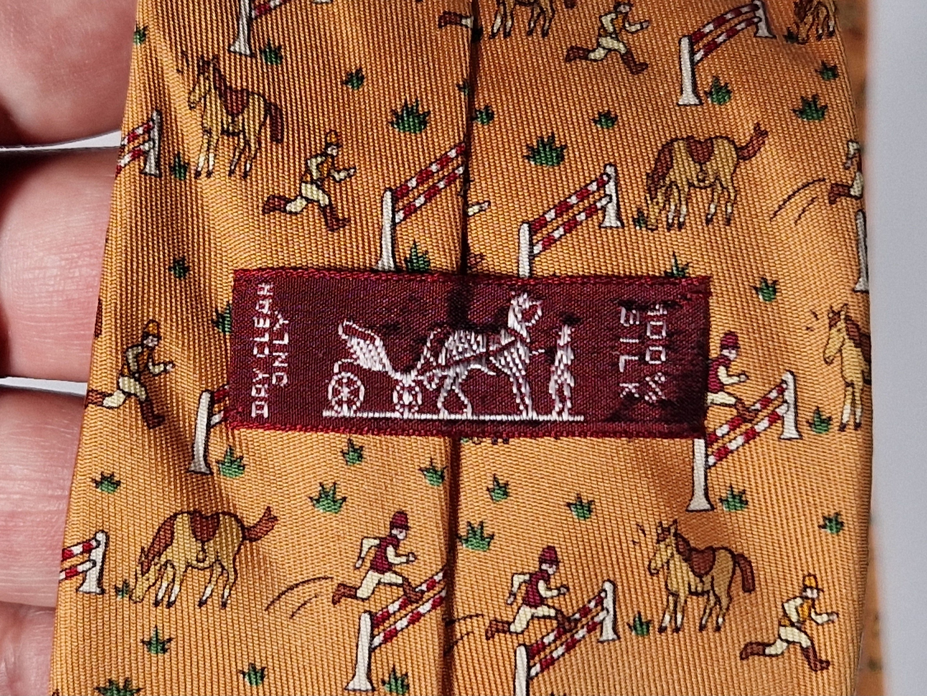 Hermès silk tie orange whimsical equestrian pattern 5042 PA