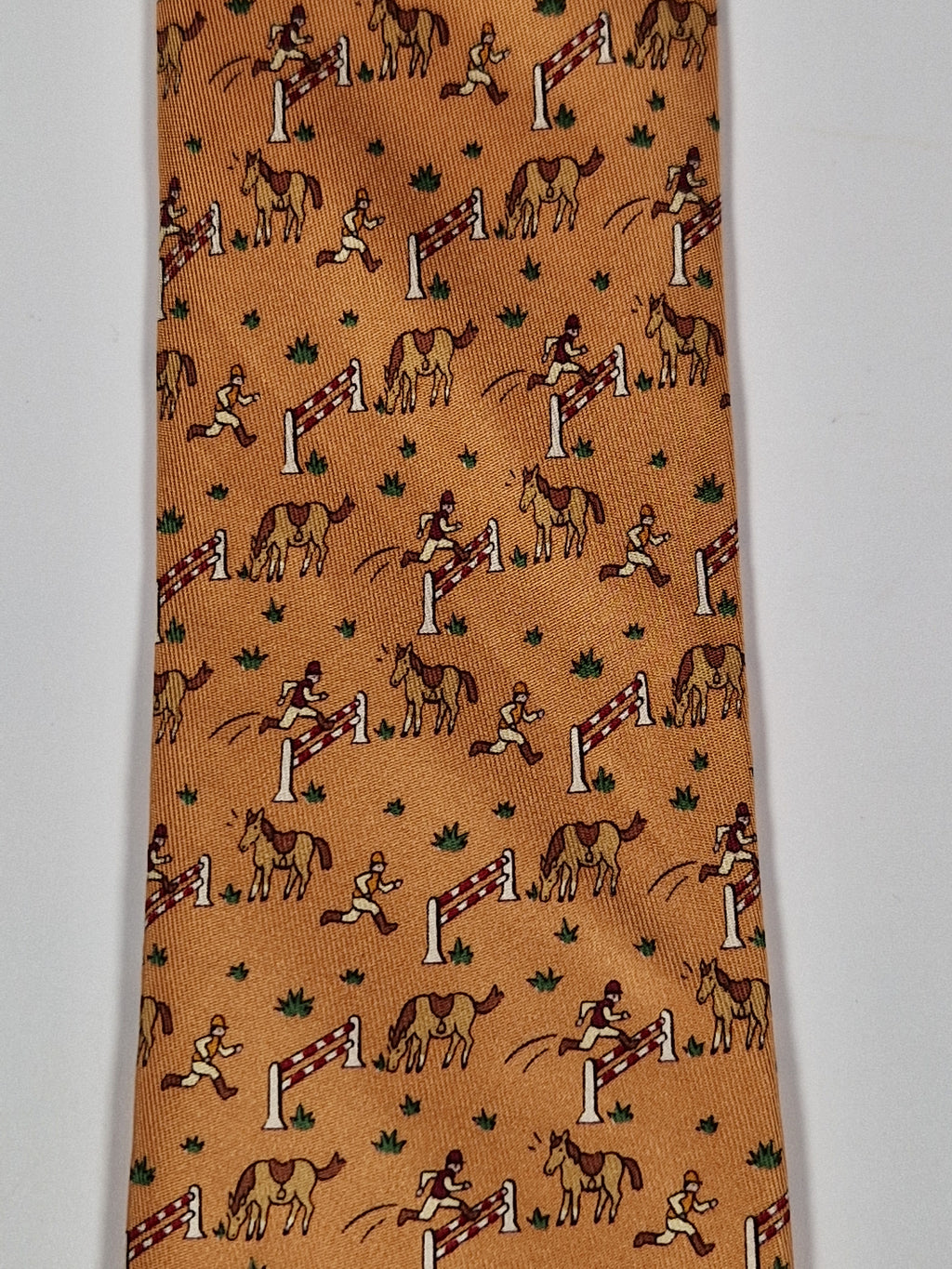 Hermès silk tie orange whimsical equestrian pattern 5042 PA
