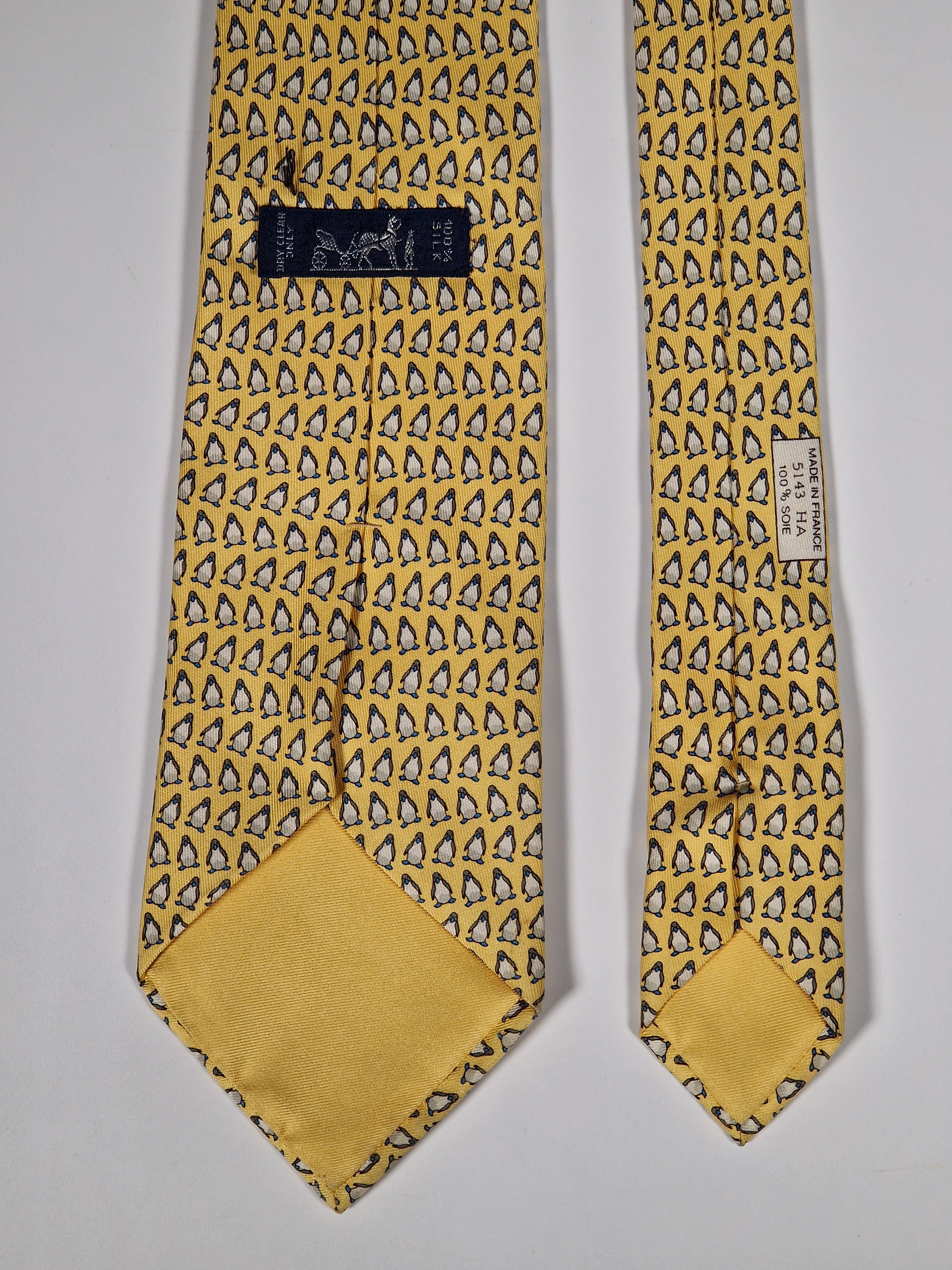 Hermès silk tie yellow whimsical pinguins pattern 5143 HA