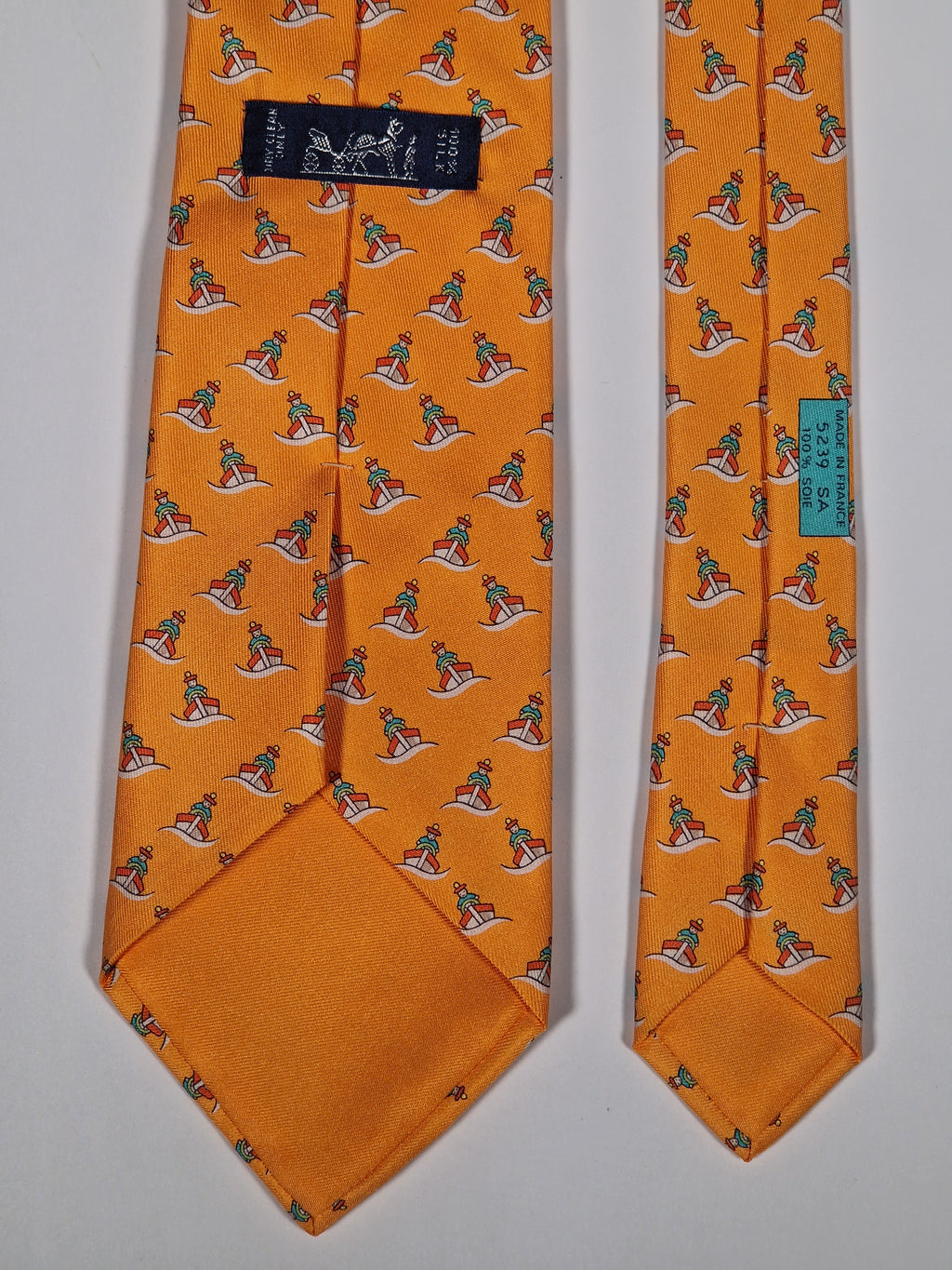 Hermès silk tie orange ship and sailor whimsical pattern 5239 SA