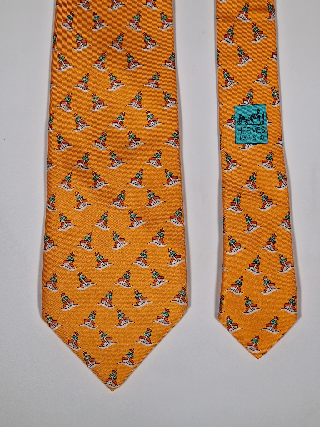 005239 Hermès tie orange whimsical seaman and boat 5239 SA
