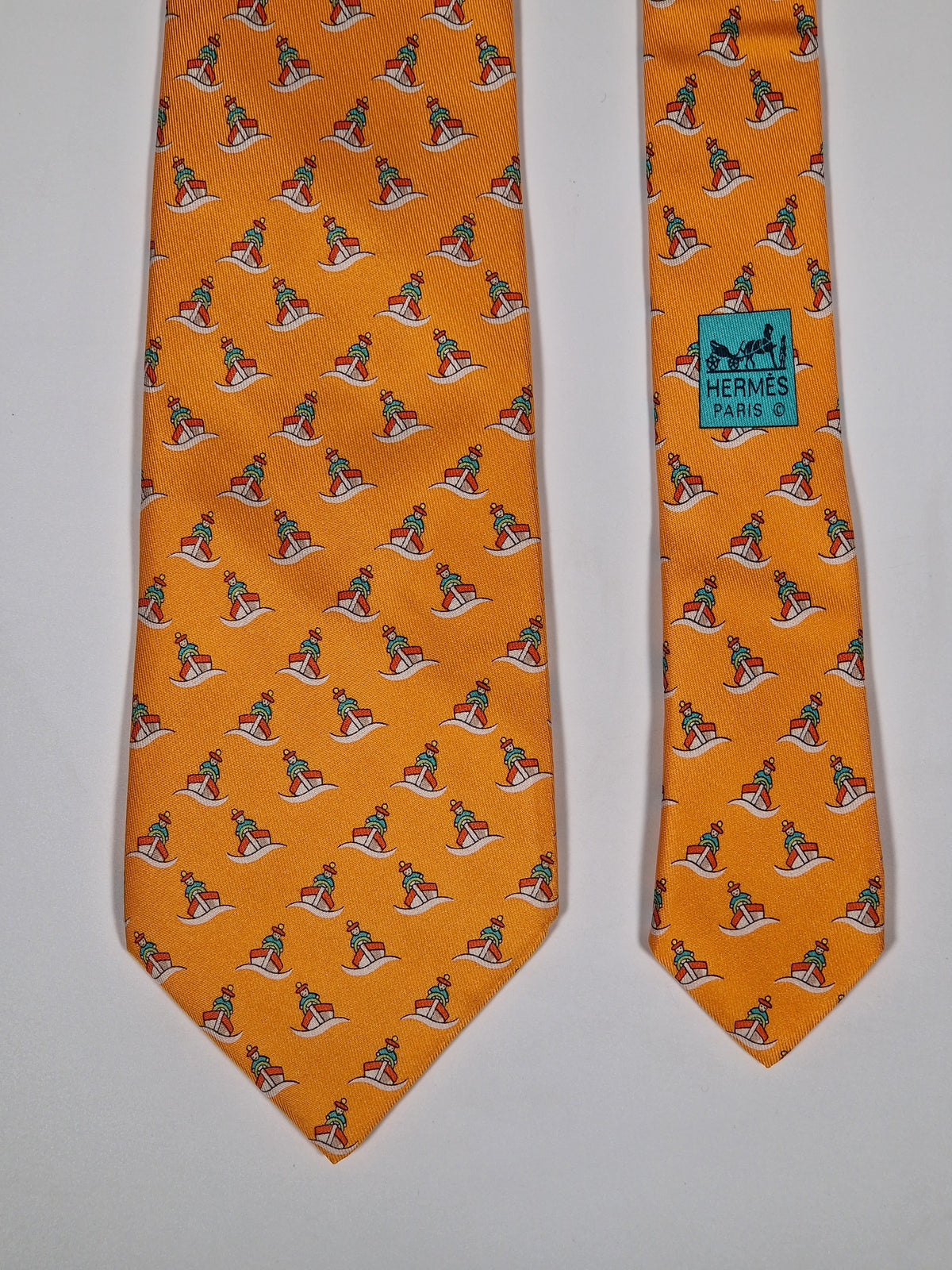 005239 Hermès tie orange whimsical seaman and boat 5239 SA