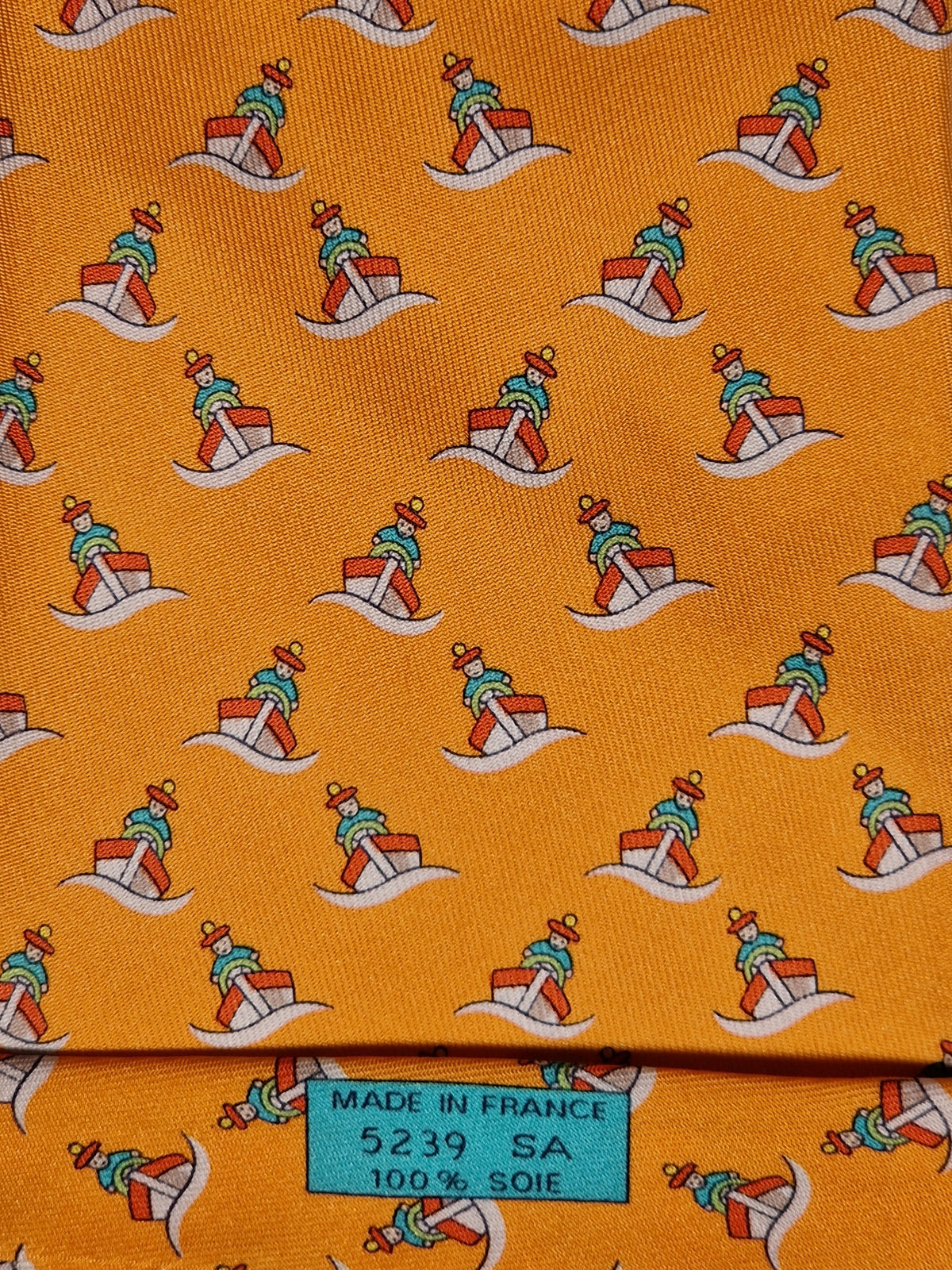 005239 Hermès tie orange whimsical seaman and boat 5239 SA