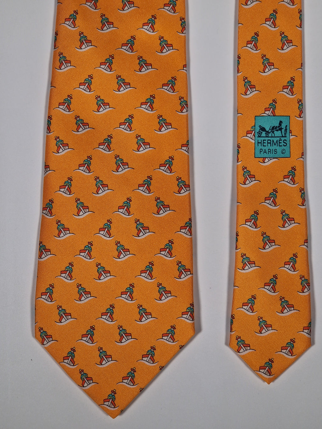 Hermès silk tie orange ship and sailor whimsical pattern 5239 SA
