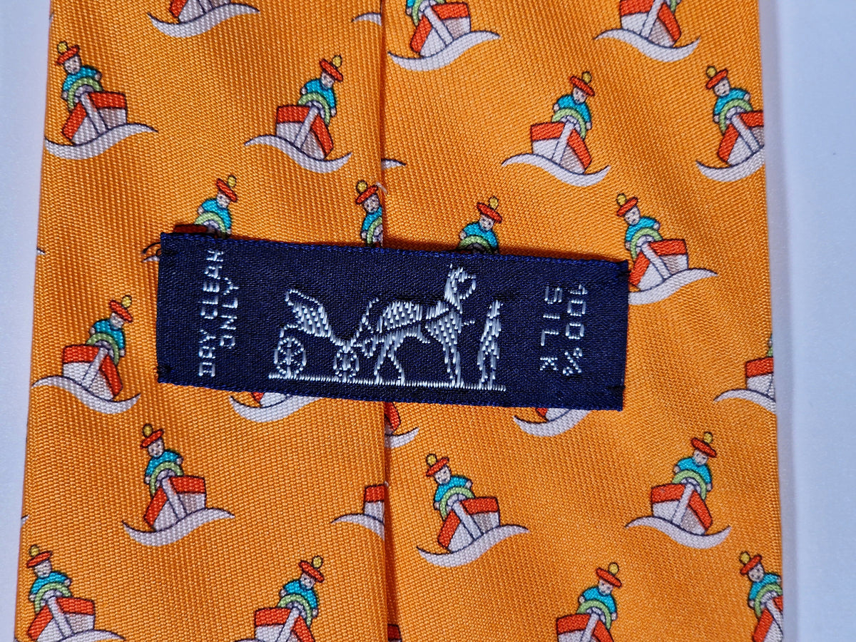 005239 Hermès tie orange whimsical seaman and boat 5239 SA
