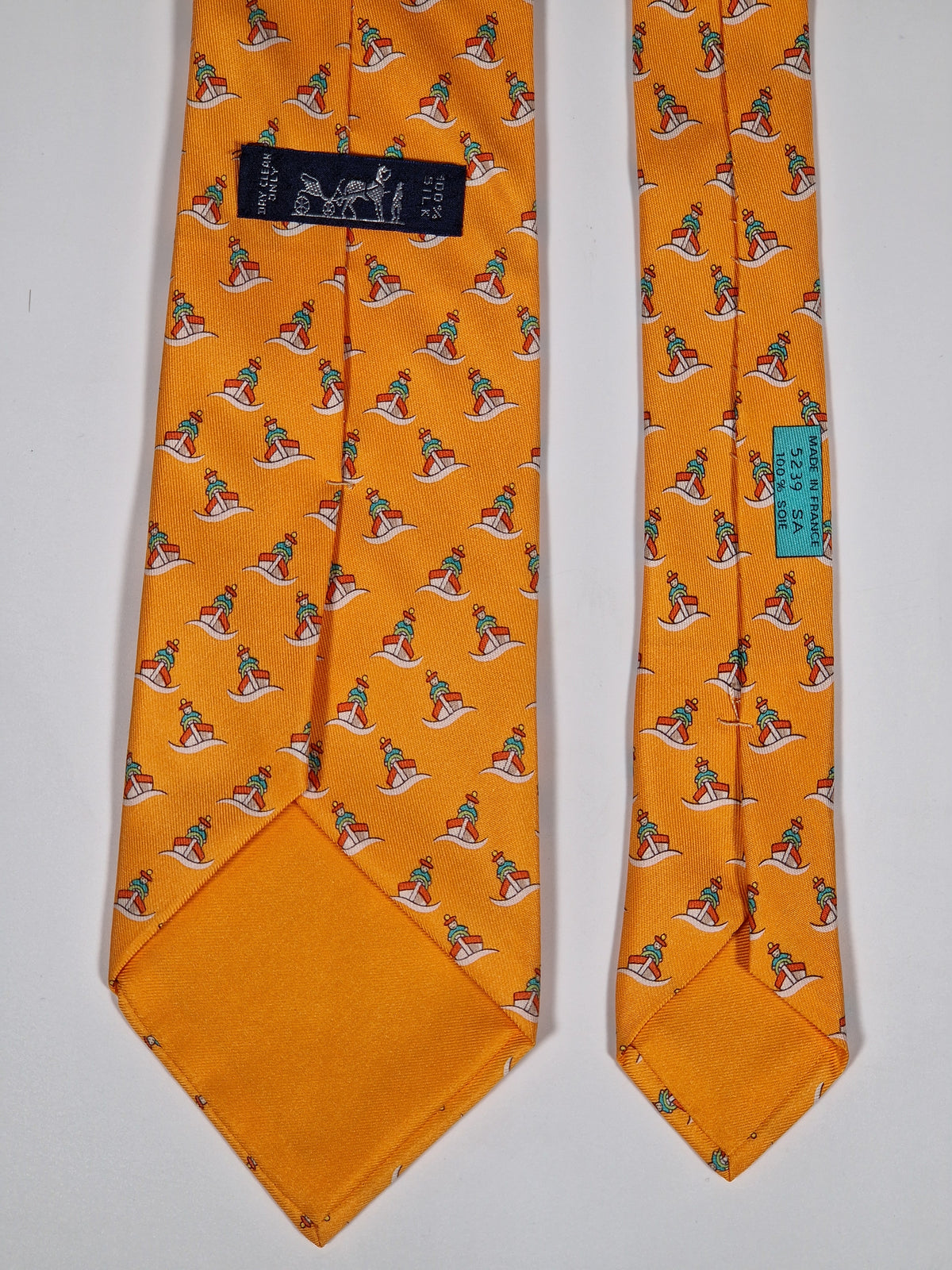 005239 Hermès tie orange whimsical seaman and boat 5239 SA