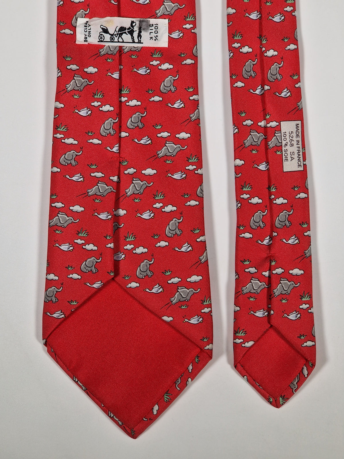 005268 Hermès tie red whimsical flying elephant 5268 SA