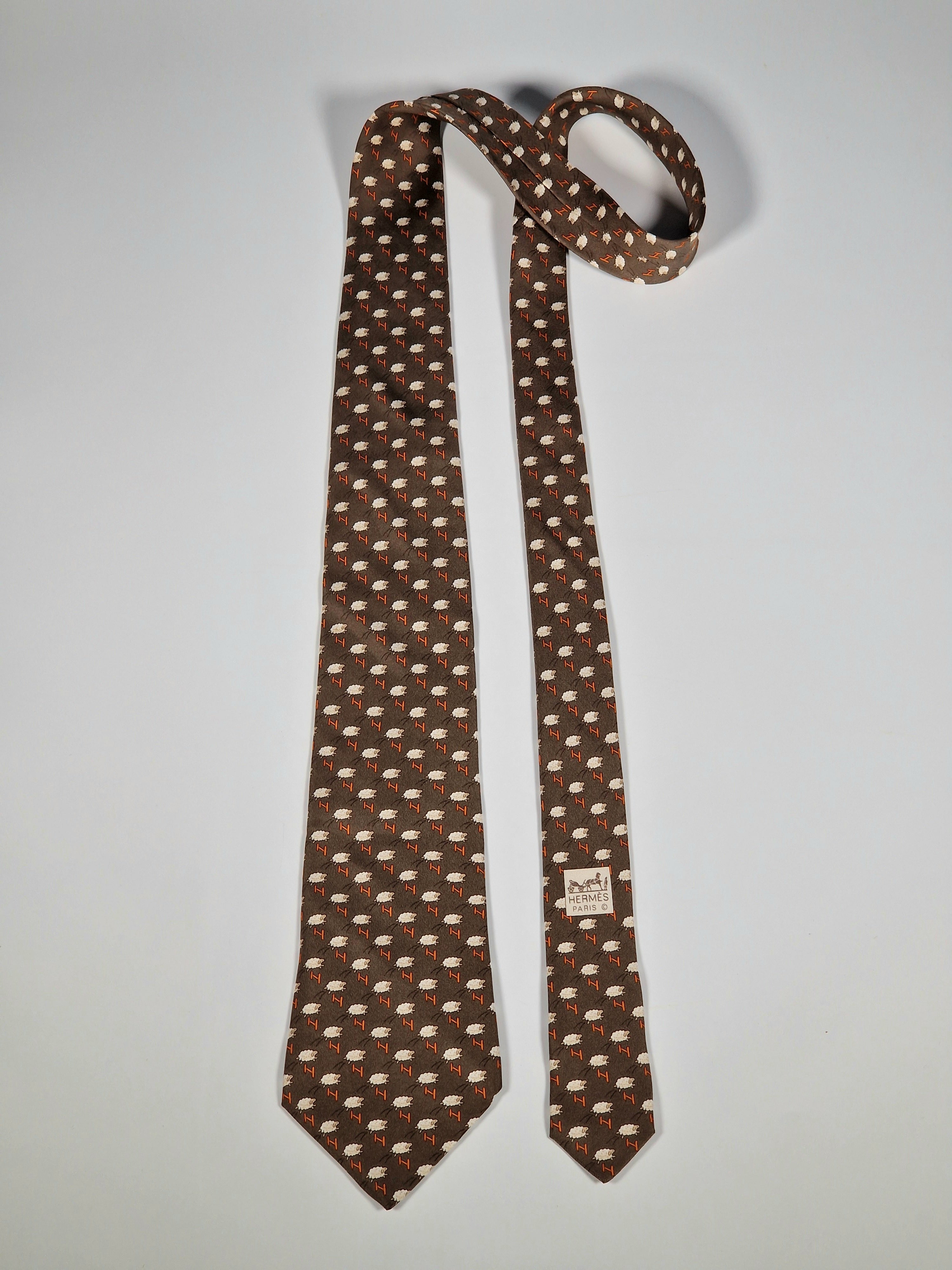 Hermès silk tie brown whimsical jumping sheep and H pattern 5273 SA