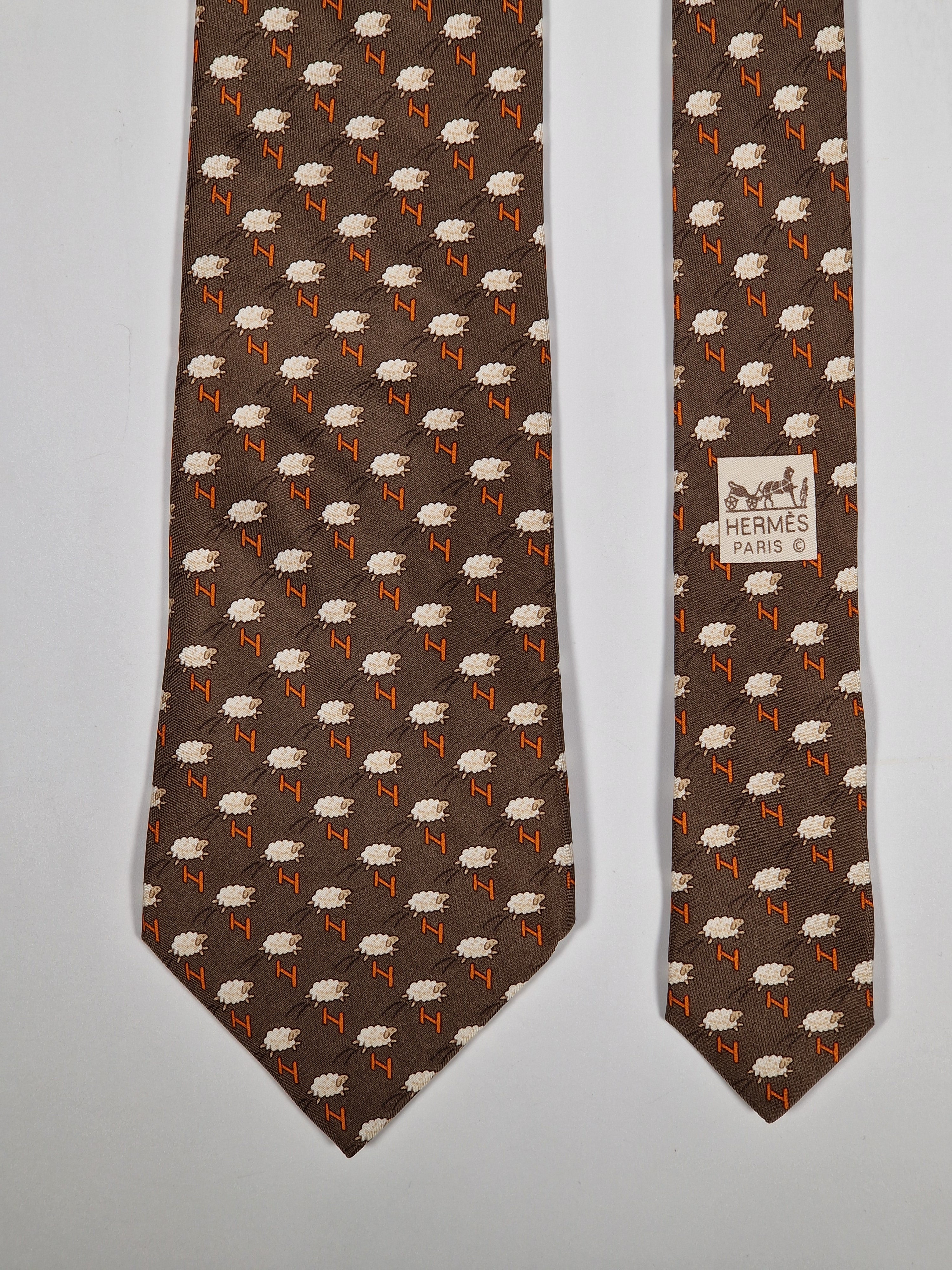 Hermès silk tie brown whimsical jumping sheep and H pattern 5273 SA