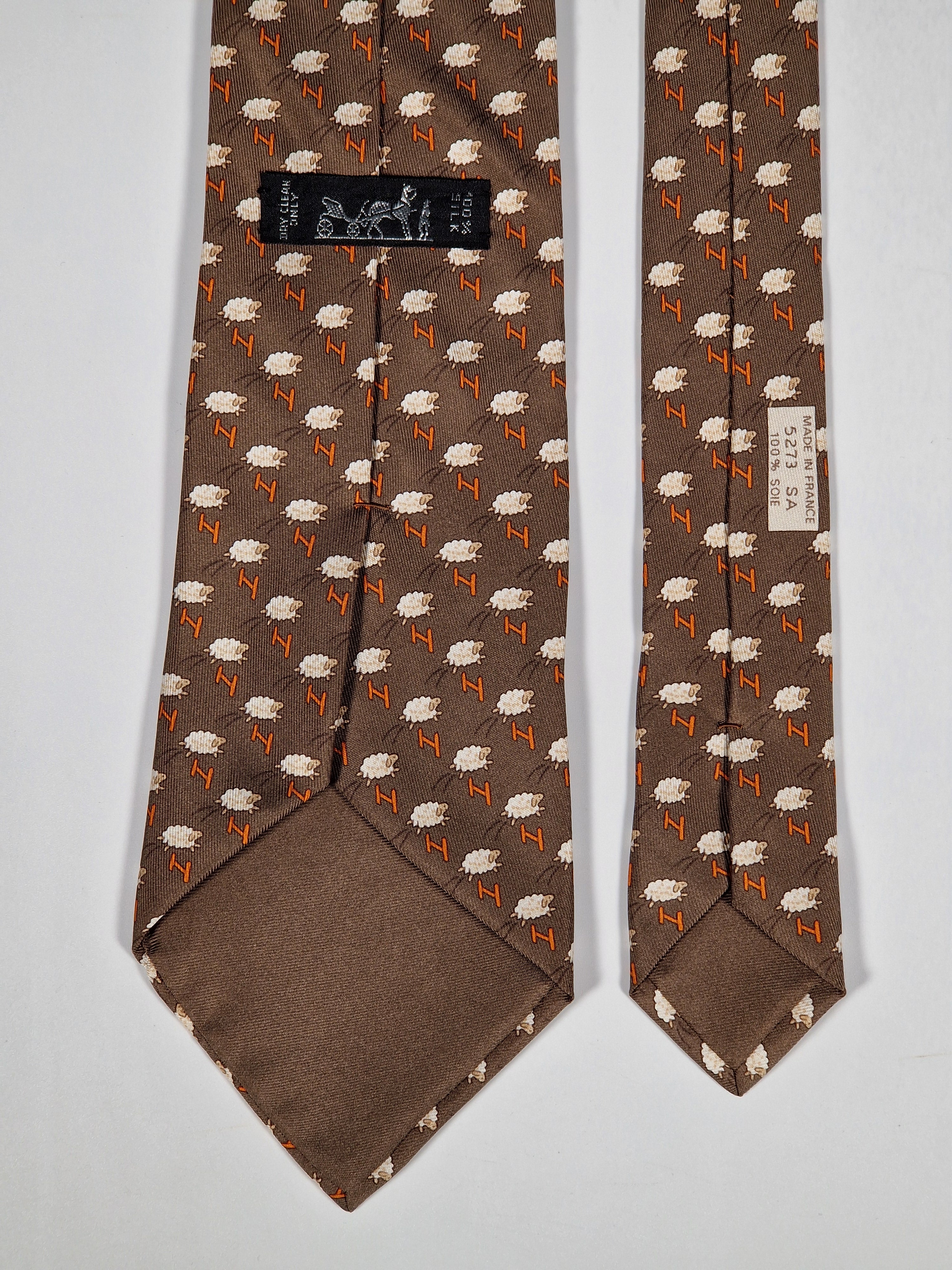 Hermès silk tie brown whimsical jumping sheep and H pattern 5273 SA