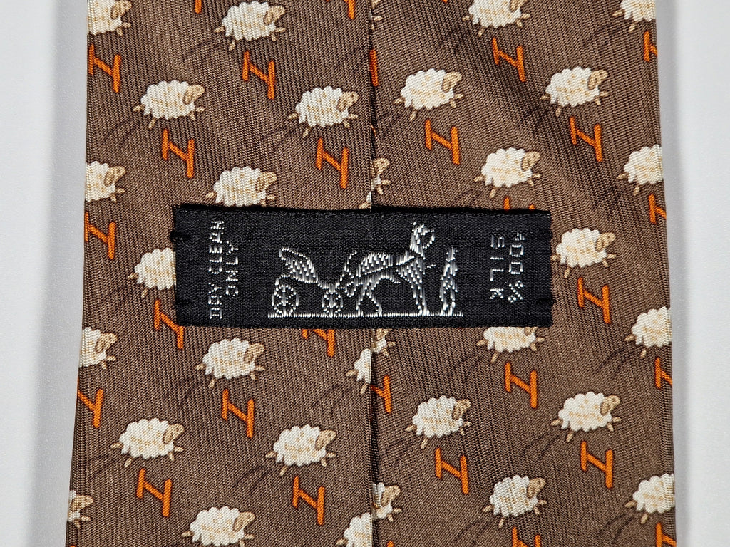 Hermès silk tie brown whimsical jumping sheep and H pattern 5273 SA