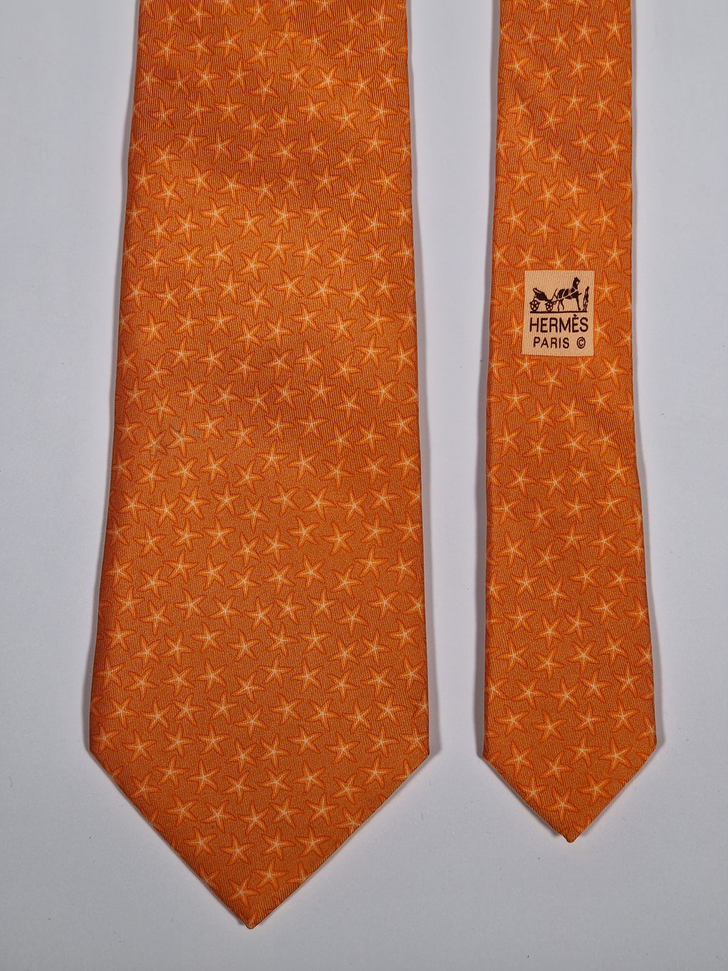 005302 Hermès silk tie orange star pattern 5302 TA