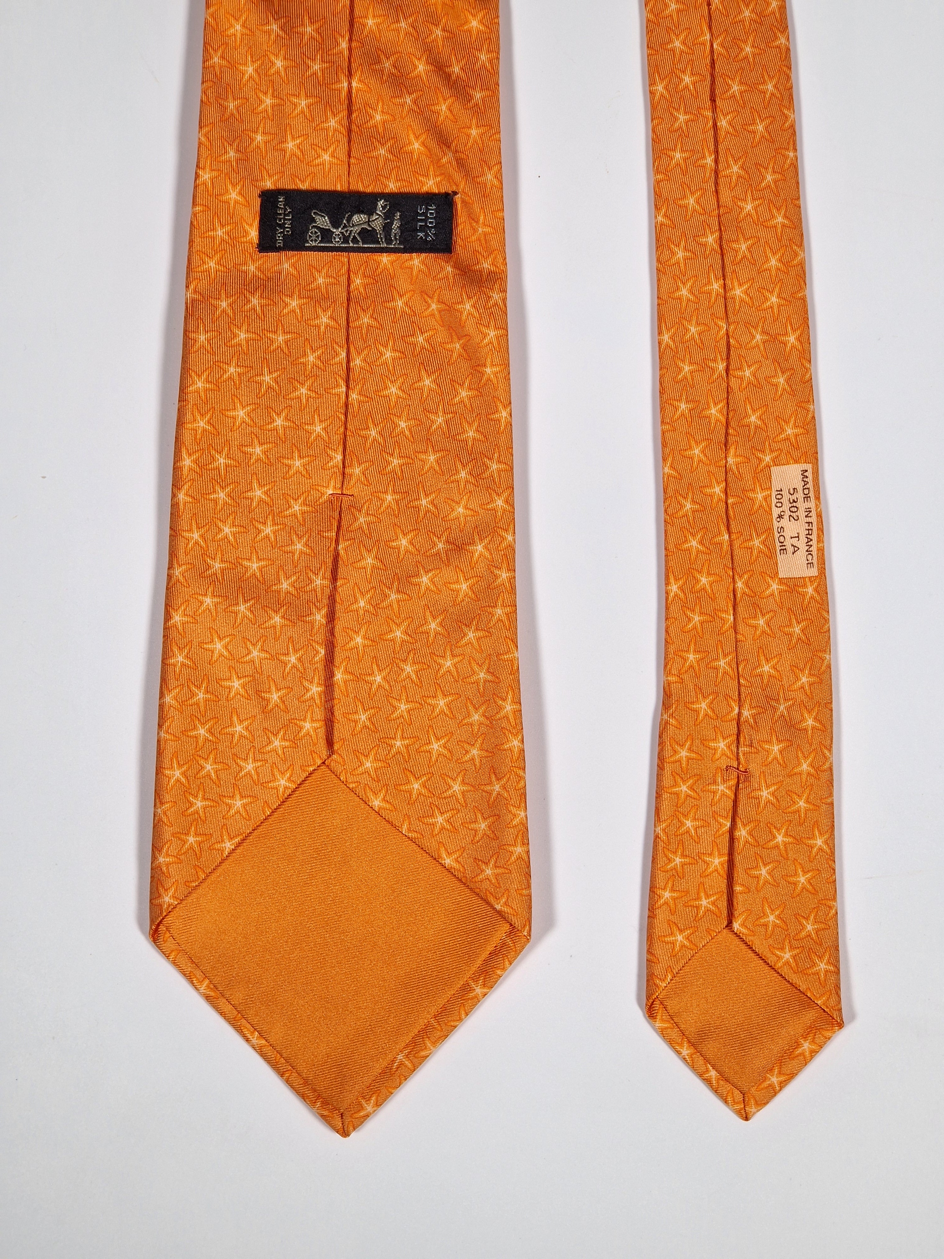 005302 Hermès silk tie orange star pattern 5302 TA