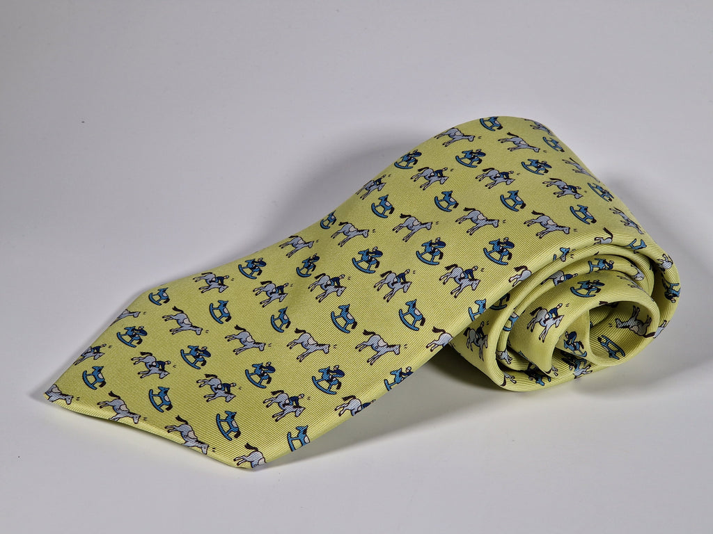 Hermès silk tie yellow horse, jockey and rocking horse 5313 TA