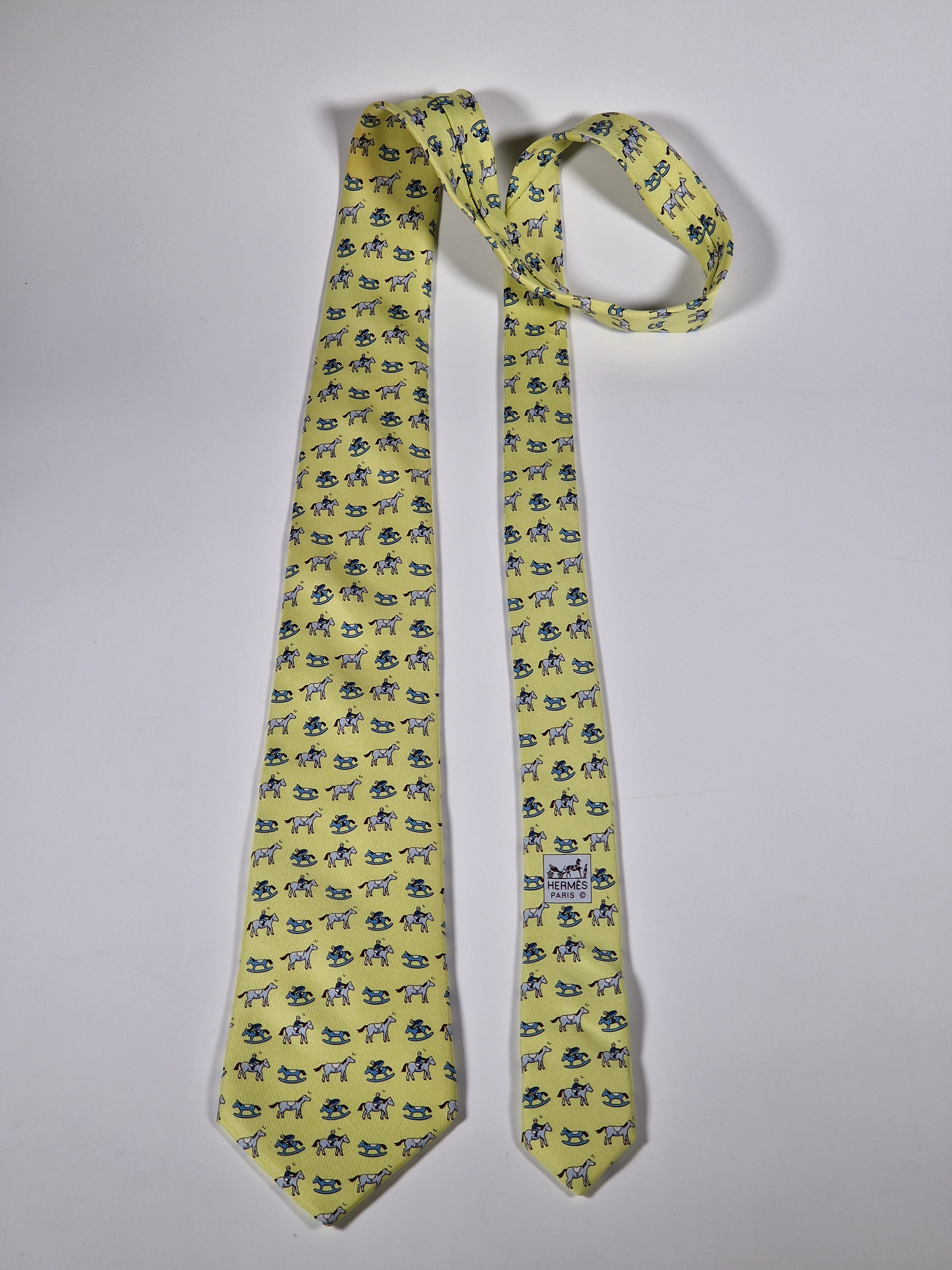 Hermès silk tie yellow horse, jockey and rocking horse 5313 TA