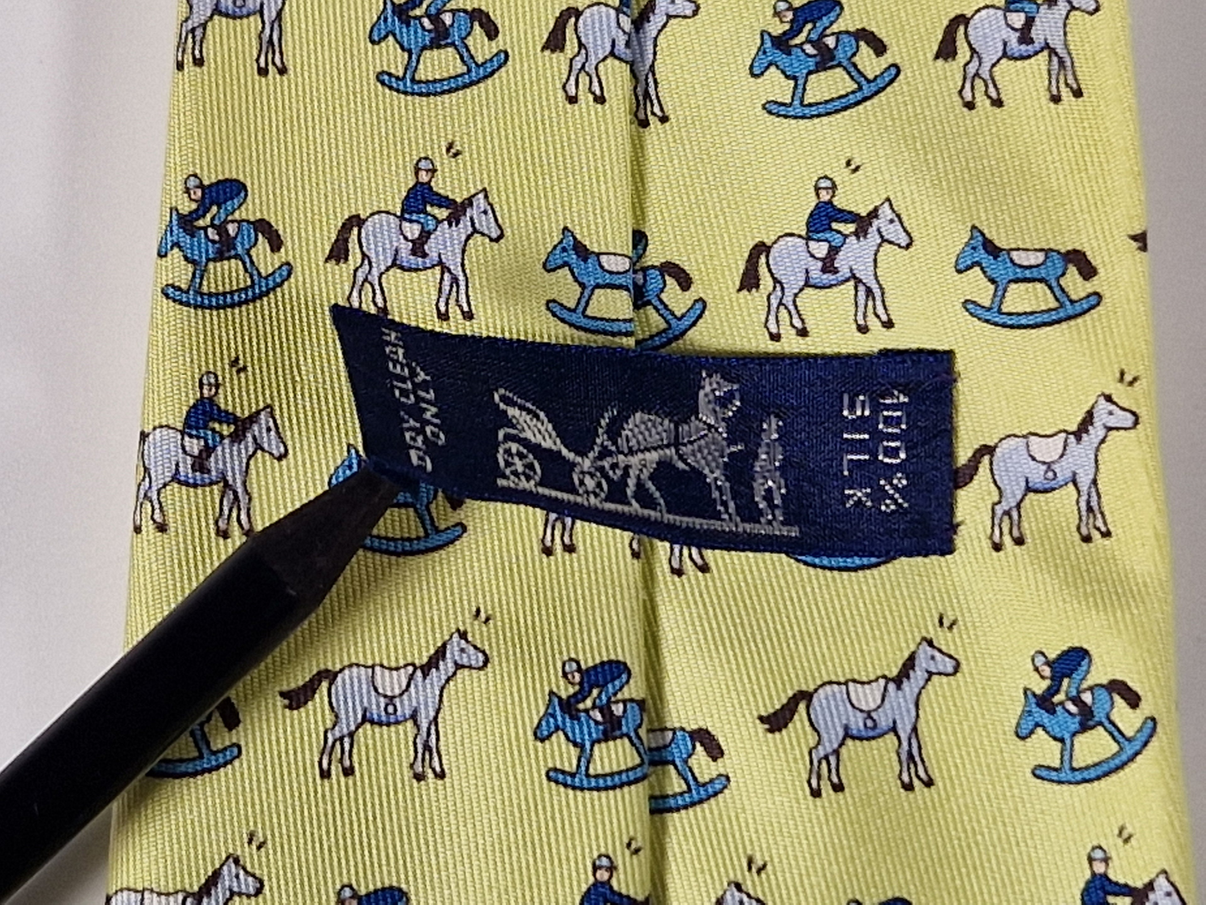 Hermès silk tie yellow horse, jockey and rocking horse 5313 TA