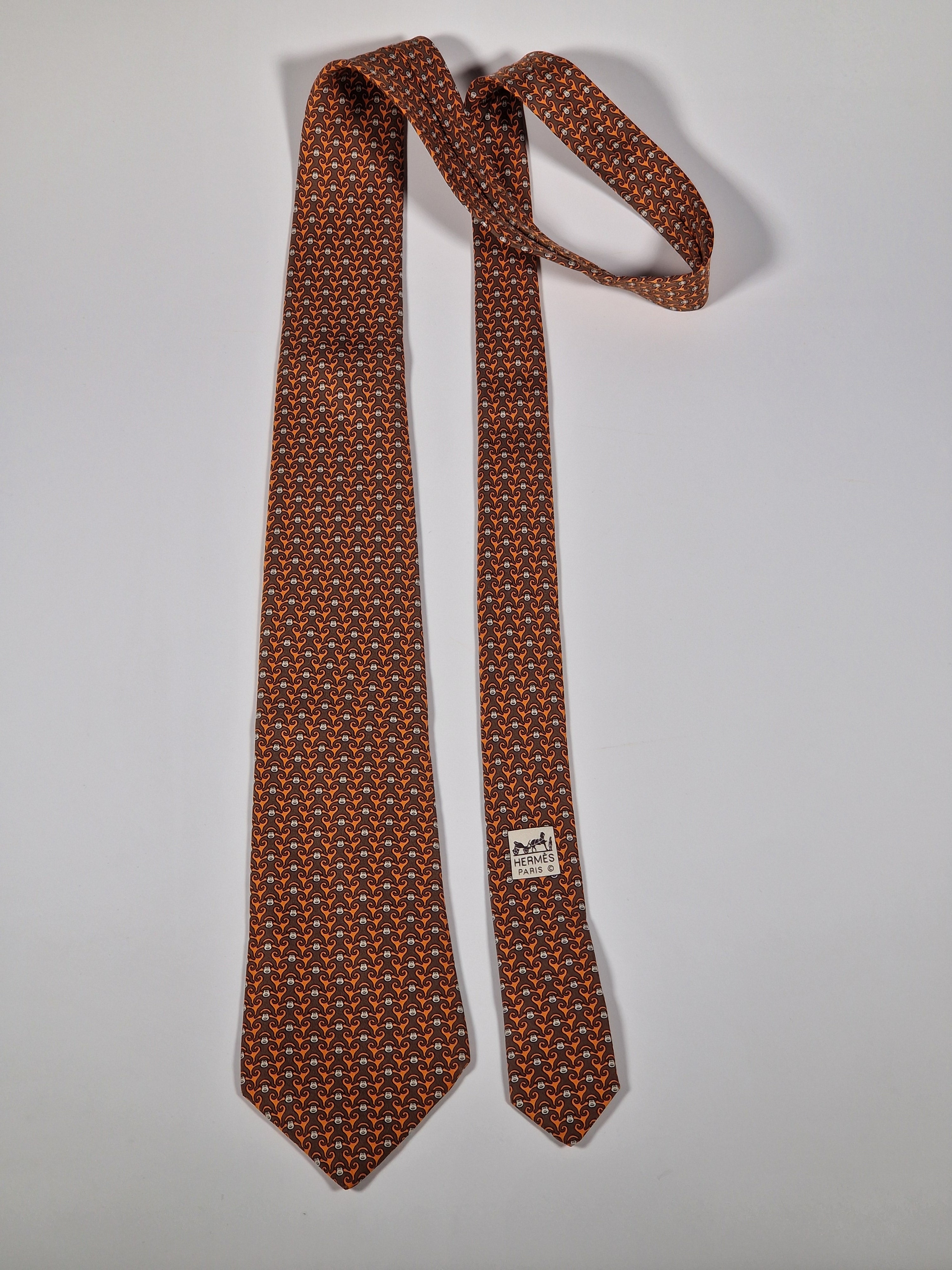 Hermès silk tie orange and brown monkey pattern 5384 oa